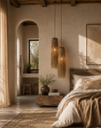 Cozy bedroom with natural light, wooden furniture, and earthy tones.