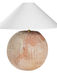 KULALA Living Debele clay table lamp with white linen pyramid shade, showcasing a modern lighting design on a wooden surface.