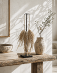 Decorative items on a wooden surface with a neutral background