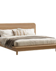 Flynn Oak Bed by KULALA Living featuring a natural oak wood frame and modern design, shown from a side perspective.