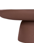 Tarran coffee table in cinnabar clay finish with rounded top and sculptural cylindrical leg