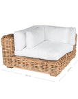 Natural wicker corner chair with thick white cushions, showcasing a coastal-inspired design perfect for indoor and outdoor settings