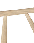 Lightwood spindle dining chair with a curved backrest and white upholstered seat, showcasing a modern yet timeless design. Crafted from solid wood, this chair brings a refined, natural aesthetic to any dining or living space