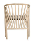 Lightwood spindle dining chair with a curved backrest and white upholstered seat, showcasing a modern yet timeless design. Crafted from solid wood, this chair brings a refined, natural aesthetic to any dining or living space