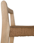 Modern bar stool crafted from lightwood with a woven rope seat and sleek geometric frame. A minimalist backrest provides subtle support, making it a stylish and functional addition to any kitchen or bar area
