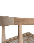 Modern lightwood dining chair featuring a sculpted timber backrest and a handwoven rope seat. A perfect blend of natural materials and contemporary craftsmanship for stylish dining spaces