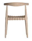 Modern lightwood dining chair featuring a sculpted timber backrest and a handwoven rope seat. A perfect blend of natural materials and contemporary craftsmanship for stylish dining spaces