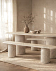 Ayanda dining table with bench in dune styled in a minimal neutral space with soft light and textured finishes.