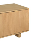 Bajo Entertainment Unit in natural oak with four flat-panel doors and a low-profile design.