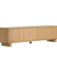 Bajo Entertainment Unit in natural oak with four flat-panel doors and a low-profile design.
