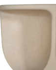 Berber coffee table in driftstone finish featuring sculptural curved legs and a softly rounded top with a textured natural surface.