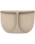 Berber coffee table in driftstone finish featuring sculptural curved legs and a softly rounded top with a textured natural surface.