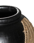 Kulala Living black clay vase featuring intricate woven rattan detailing, blending artisanal craftsmanship with organic textures. A striking decorative accent for contemporary and coastal interiors