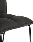 Black cushioned bar stool with a plush, padded seat and backrest, supported by a sleek black metal frame for a modern and comfortable seating option