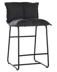 Black cushioned bar stool with a plush, padded seat and backrest, supported by a sleek black metal frame for a modern and comfortable seating option