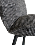 A black metal bar stool with a cushioned seat and backrest upholstered in dark linen fabric. Featuring a sleek yet relaxed design, this stool blends comfort with modern sophistication, ideal for contemporary kitchens or bar spaces
