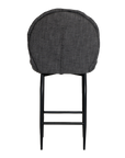 A black metal bar stool with a cushioned seat and backrest upholstered in dark linen fabric. Featuring a sleek yet relaxed design, this stool blends comfort with modern sophistication, ideal for contemporary kitchens or bar spaces