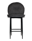 A black metal bar stool with a cushioned seat and backrest upholstered in dark linen fabric. Featuring a sleek yet relaxed design, this stool blends comfort with modern sophistication, ideal for contemporary kitchens or bar spaces