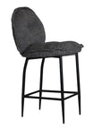 A black metal bar stool with a cushioned seat and backrest upholstered in dark linen fabric. Featuring a sleek yet relaxed design, this stool blends comfort with modern sophistication, ideal for contemporary kitchens or bar spaces