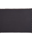 A black and natural handwoven bedhead featuring intricate geometric patterns, crafted from durable natural fibres for a timeless and earthy aesthetic.