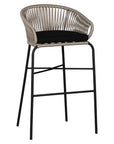 Black natural outdoor bar chair featuring a woven rope backrest and sleek metal legs, designed for modern alfresco dining and stylish patio settings