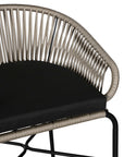 Black natural outdoor bar chair featuring a woven rope backrest and sleek metal legs, designed for modern alfresco dining and stylish patio settings
