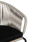 Black and natural outdoor dining chair featuring a woven rope backrest and sleek metal legs, designed for modern alfresco dining and stylish patio settings