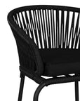 Black outdoor bar chair featuring a woven rope backrest and sleek metal legs, designed for modern alfresco dining and stylish patio settings