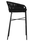 Black outdoor bar chair featuring a woven rope backrest and sleek metal legs, designed for modern alfresco dining and stylish patio settings
