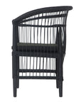 A stylish black rattan dining chair with an intricate woven design and a sleek black cushion, adding a modern touch to any dining or seating area