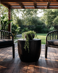 Discover the Makena Black Chair paired with the Kisiki Outdoor Stool, a modern outdoor duo crafted for relaxed, contemporary living. Stylish, durable and designed for comfort.
