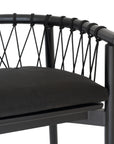 Modern black wooden barchair with woven rope backrest and cushioned seat, perfect for contemporary lounge settings