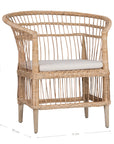 A beautifully crafted blonde rattan armchair with an open-weave design and a white cushioned seat, perfect for adding a relaxed coastal touch to any space.