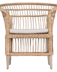 A beautifully crafted blonde rattan armchair with an open-weave design and a white cushioned seat, perfect for adding a relaxed coastal touch to any space.