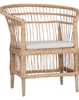 A beautifully crafted blonde rattan armchair with an open-weave design and a white cushioned seat, perfect for adding a relaxed coastal touch to any space.