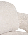 Ivory boucle armchair with rounded, sculptural design, adding modern luxury and comfort to any lounge or living space