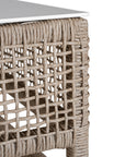 Coastal rattan coffee table with a natural woven frame and resin top, perfect for creating a relaxed, airy living space