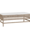 Coastal rattan coffee table with a natural woven frame and resin top, perfect for creating a relaxed, airy living space