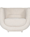 A modern curved armchair upholstered in soft ivory bouclé fabric from KULALA Living. Designed for comfort and style, this contemporary accent chair adds elegance to any living space
