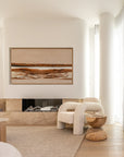 Curved boucle armchair styled beside a sculptural solid wood side table beneath the Scape wall art by KULALA Living, set in a modern neutral interior with soft curves and natural textures