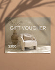 Kulala Living gift voucher featuring a neutral-toned armchair with a textured cushion, a rustic clay vase, and soft natural light, creating an elegant and timeless gifting option