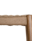 The Kulala Living Handwoven Counter Stool in natural features a meticulously woven seat crafted from durable fibre, supported by a solid timber frame with a sleek black finish. This modern yet timeless piece adds texture and sophistication to kitchen and bar spaces.
