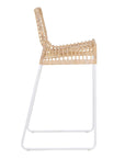 A stylish bar stool featuring a handwoven natural rattan seat and a sleek white metal frame. Designed for modern coastal and contemporary spaces, this lightweight yet sturdy stool adds texture and warmth to kitchen and bar areas