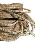 Set of handwoven seagrass baskets with sturdy, curved handles, featuring a natural tone and intricate weaving for stylish and functional storage