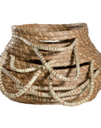 Set of handwoven seagrass baskets with sturdy, curved handles, featuring a natural tone and intricate weaving for stylish and functional storage