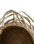 Set of handwoven seagrass baskets with sturdy, curved handles, featuring a natural tone and intricate weaving for stylish and functional storage