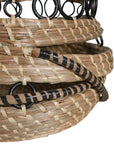 A set of handwoven natural baskets featuring intricate black metal ring detailing and striped accents. Crafted from organic fibres, these versatile storage baskets add a touch of artisanal craftsmanship to any space
