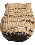 A unique handwoven rattan decorative basket with an open-weave design and a dark wooden base. A statement piece that adds texture and organic warmth to any interior