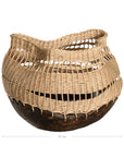 A unique handwoven rattan decorative basket with an open-weave design and a dark wooden base. A statement piece that adds texture and organic warmth to any interior