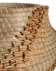 Handwoven seagrass basket with organic textured detailing, featuring natural tones and intricate weaving, ideal for contemporary home decor